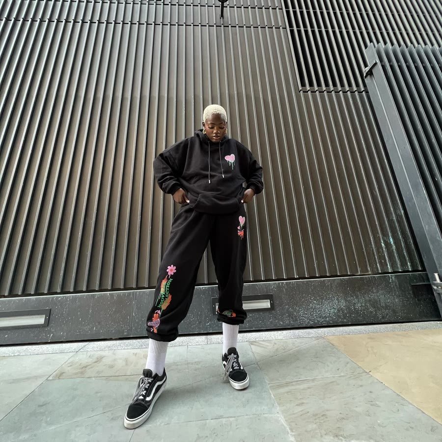 Black embroidered tracksuit, street shot from the front